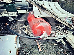 an old .fire extinguishers on a dump