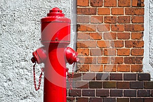 Old fire hydrant against the brick wall