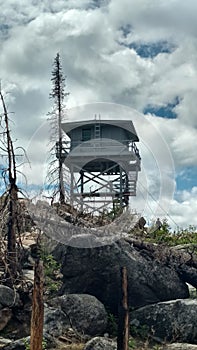 Old Fire Lookout Tower With Burned Trees