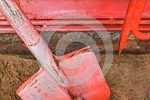 Old fire red box with a shovel and hook and tools to help during a dangerous situation