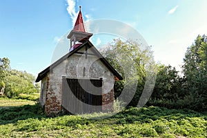 Old firehouse with wooden gate and red roof