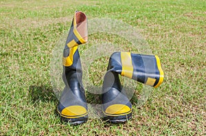 Fireman boots on grass background