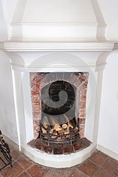 Old fireplace with firewood