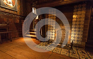 Old fireplace in room with wooden furniture, in printing museum of Plantin-Moretus, UNESCO World Heritage Site