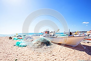 Old fisher boat at the beach at Armacao de Pera in Portugal