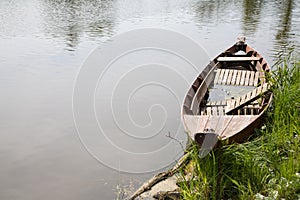 Old fisher boat in the river: Vintage mourning background