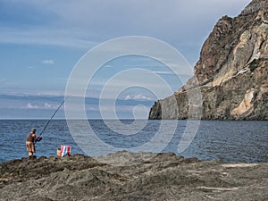 Old fisherman on the coasts of the island of pantelleria, Italy