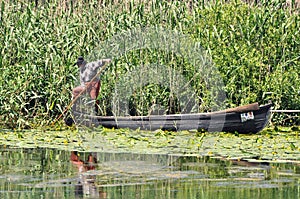 Old fisherman in his boat
