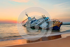 Old fishing boat abandoned in the sea, Chonburi, Thailand