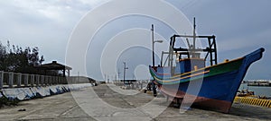 Old fishing boat aground at fishing port