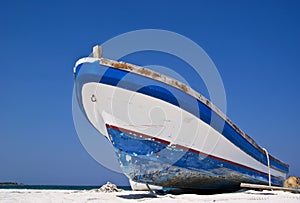 Old fishing boat on a Caribbean beach.