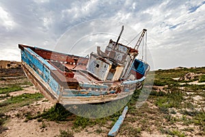 Old fishing boat on land