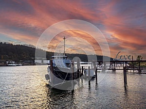 Old Fishing Boat Moored On A Pier In A Small River