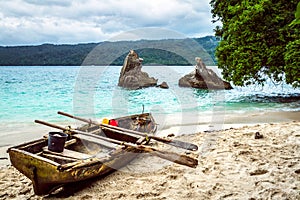 Old fishing boat pulled on the beach