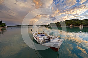 Old fishing boat in a quiet creek at Porto-Heli, Greece.