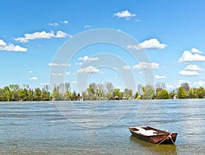 Old fishing boat on river spring blue sunny day Danube Serbia Zemun Gardos Kej photo