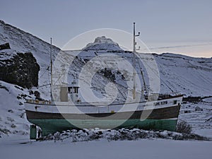 Old fishing boat beside the road near Olafsvik