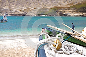 Old fishing boat on the shore. Boat with nets waiting for fishermen on the beach of Cape Verde