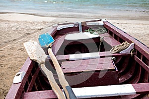 Old fishing boat on the shore. Boat with nets waiting for fishermen on the beach of Cape Verde