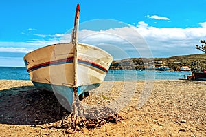 old fishing boat stranded on the beach in Cadaques, Costa Brava, Spain