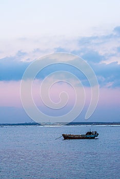 Old fishing boat at sunset