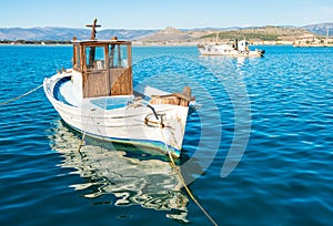 Old fishing boats in the calm waters of Mediterranean sea