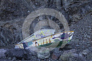 Old fishing boats sprayed by local youth with graffity on the island of La Gomera