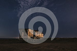 Old fishing hut in the night