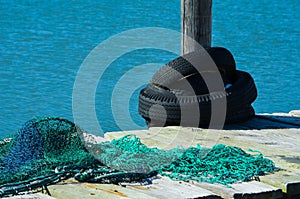 Old Fishing Nets and Tires on the Dock