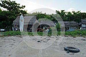 Old fishing shack and Surfboard by the beach, Bali, Indonesia