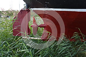 Old fishing ship fragment with propeller