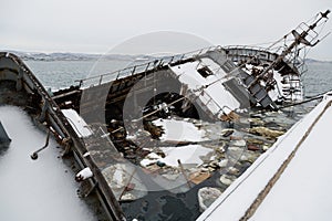 Old fishing ship sank at pier in port