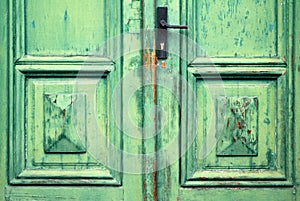 Old flaked classic green door