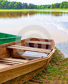 An old flooded boat on a rural river