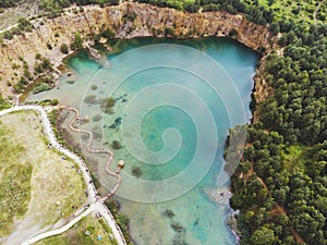 Old flooded quarry with path as Maledives