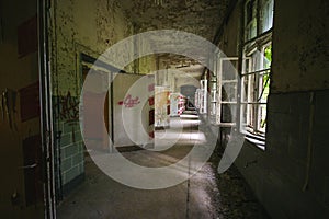 An old floor with open doors and windows in an abandoned places