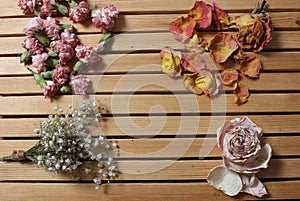 Old Flowers Drying on Wooden Table. Zinnia With Roses and Carnations