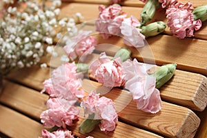 Old Flowers Drying on Wooden Table. Zinnias With Roses and Carnations