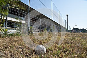 Old football in an abandoned football stadium