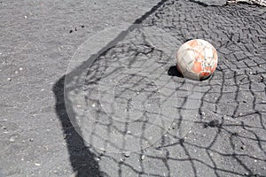 Old football + shadow of a football goal