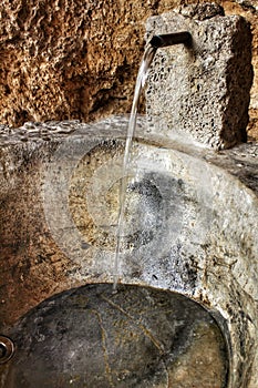 Old forged tap of a fountain in Chelva village, Spain