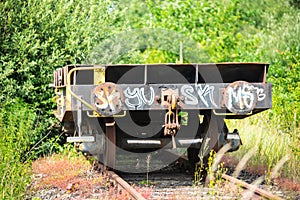 An old forgotten train carriage on a disused railway