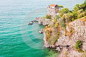 Old fort tower overlooking clear blue sea