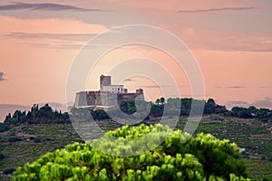 Old fort under a red sky