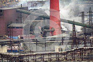 Old forties Copper-Nickel plant in smoke smoulder roof.