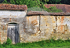 Old fortified wall with wood door