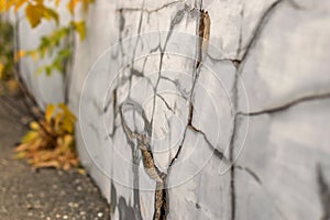 Old foundation wall with cracks and chips