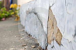 Old foundation wall with cracks and chips