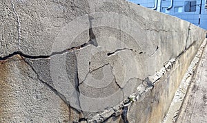 Old foundation wall with cracks and chips