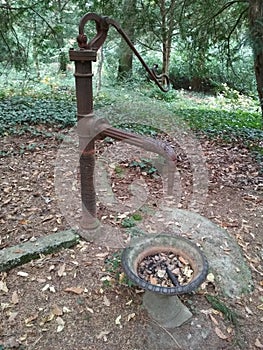 Old fount in a garden photo